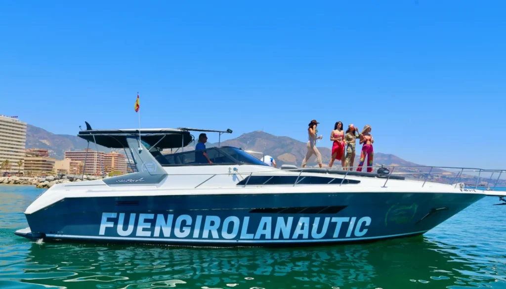 people on a boat looking at the sea
