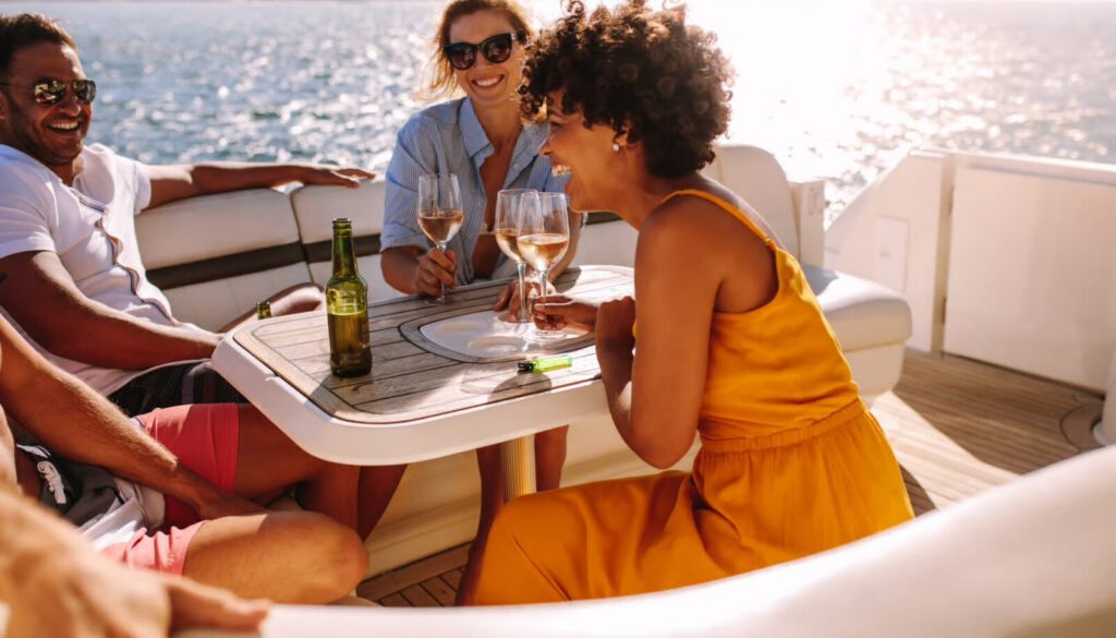 people having a good time with drinks on a boat