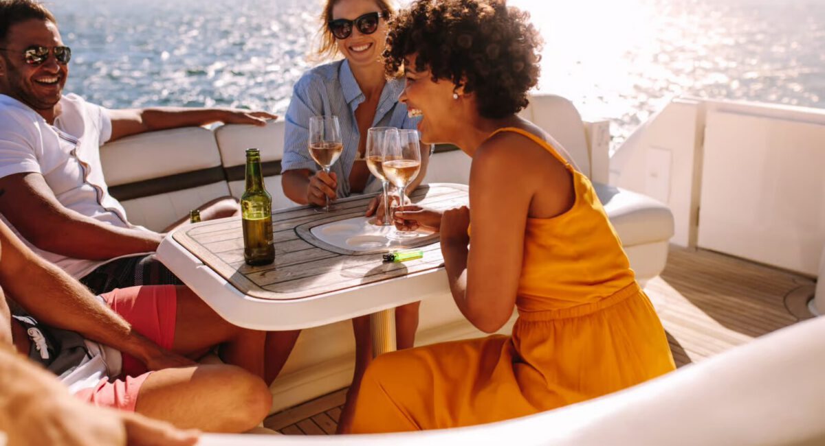 sunset boat tour copy people having a good time with drinks on a boat
