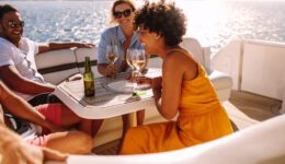people having a good time with drinks on a boat