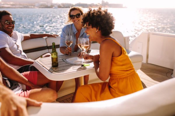 people having a good time with drinks on a boat